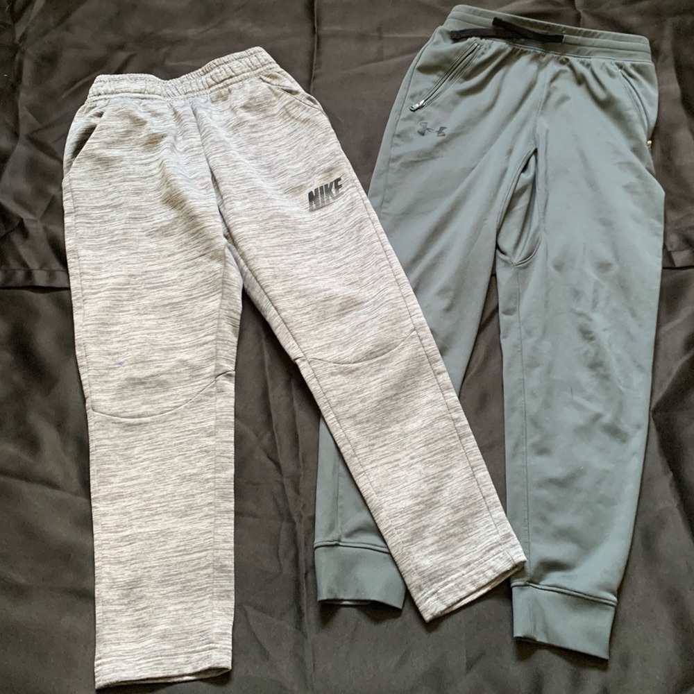 Two jogger sweatpants Nike and Under armour size Medium for boys